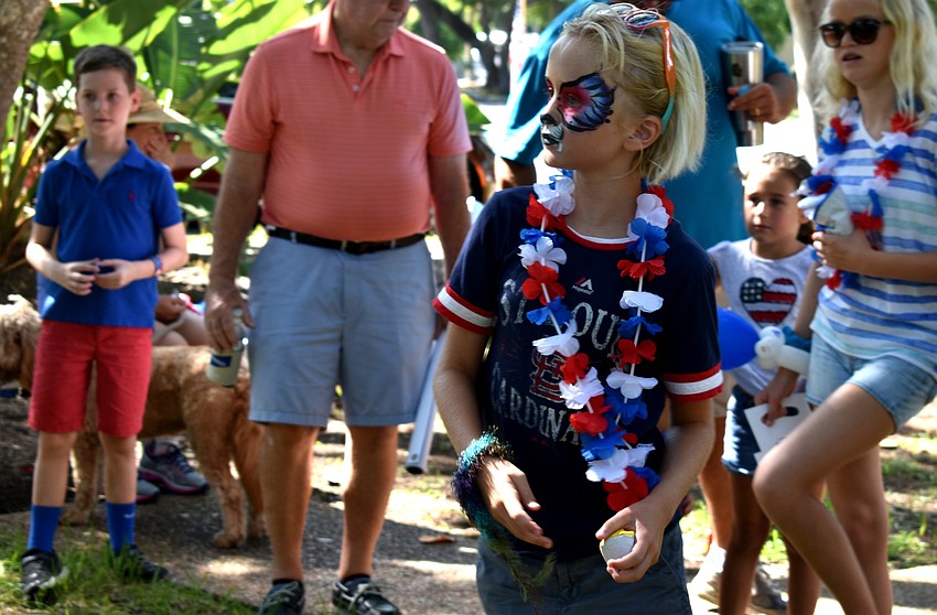 Marin Walters gets ready to throw the ball during a game after the Freedom Fest parade.