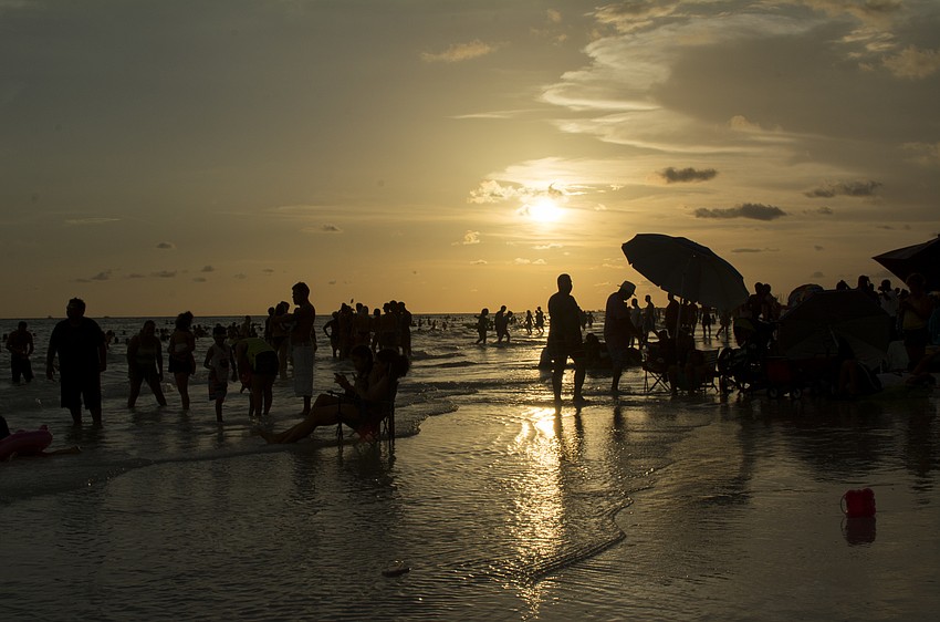 Beachgoers wait for the Siesta Key fireworks show.
