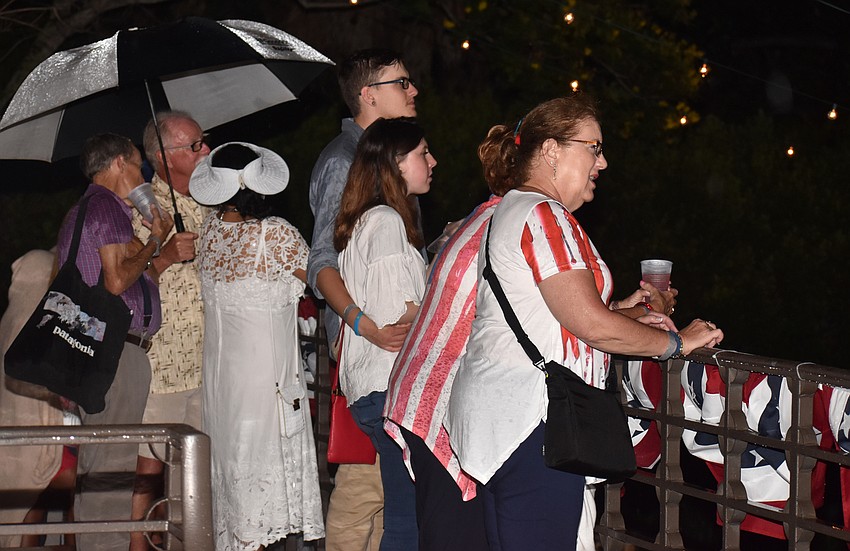 Some spectators braved the rain to watch the Bayfront fireworks show.