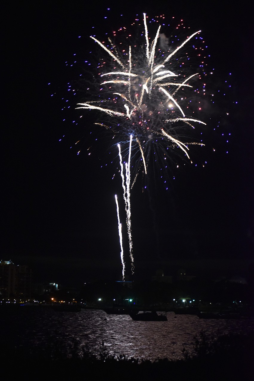 Fireworks illuminate the sky over Sarasota Bay.