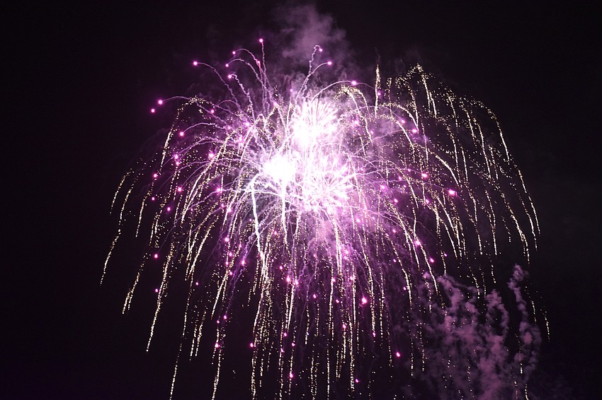 Fireworks illuminate the sky over Sarasota Bay.
