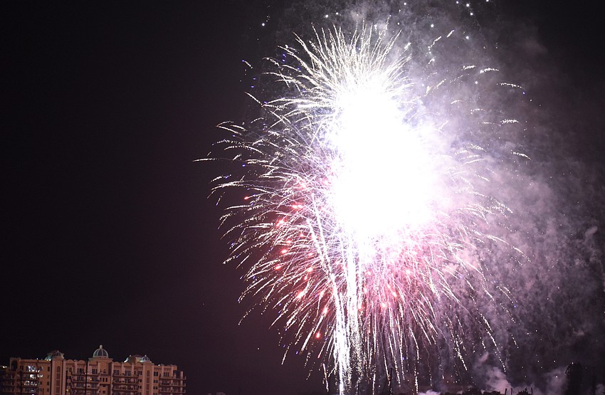 Fireworks illuminate the sky over Sarasota Bay.
