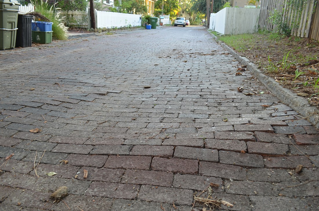 Residents say dislodged and missing bricks on Hawkins Court are causing problems.