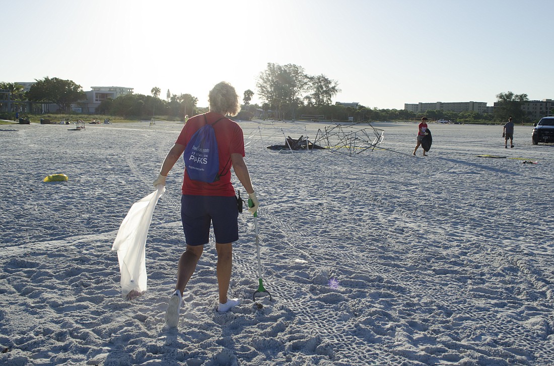 Volunteers were out early on Wednesday morning to begin cleaning Siesta Beach.