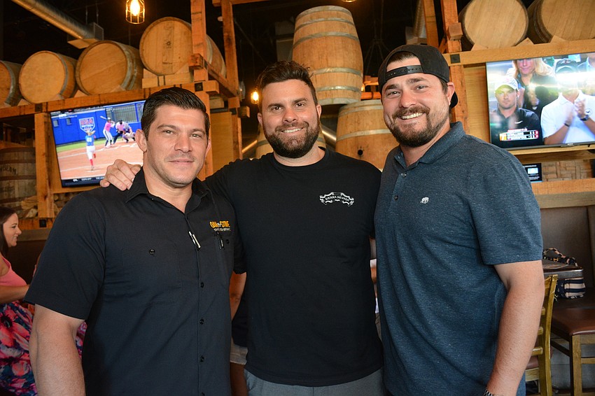 Oak and Stone General Manager Anthony Liakakos joins restaurant partners and brothers Joe and Patrick Seidensticker for  a quick photo.