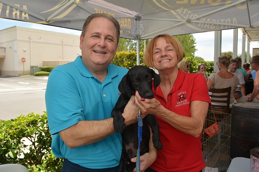 East County residents Steve and Cher Grossman volunteer at Nate's Honor Animal Rescue. They showed off Jack, a pup available for adoption at Nate's.