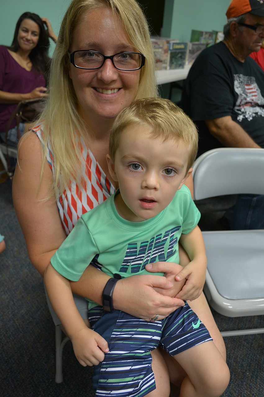 Braden Crossing resident Ashley Nicorvo holds her 2-year-old son Jayden, whose favorite animal is a shark.