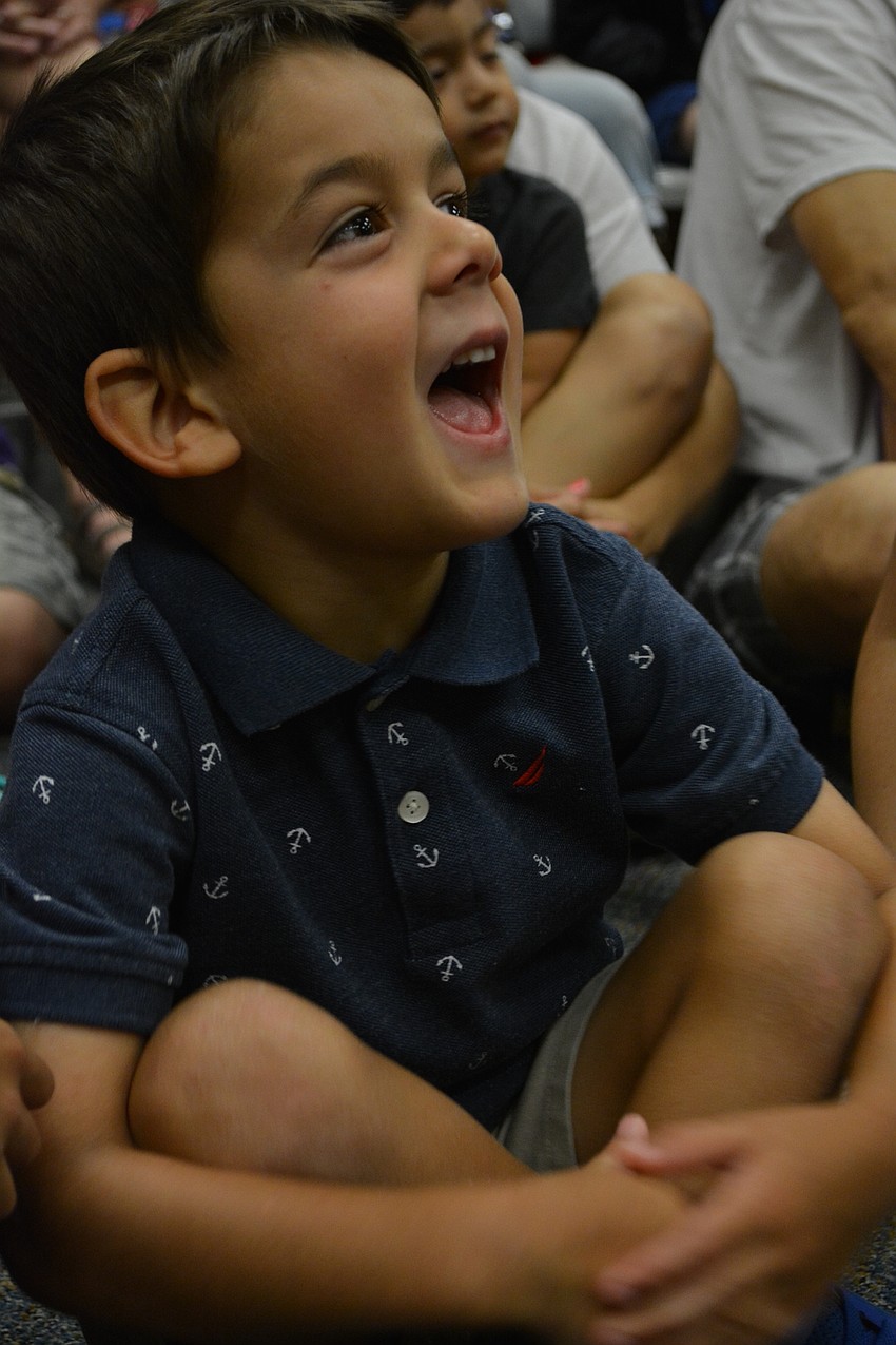 Creekwood's D.J. Cooper, 5, guesses about adaptations a snake has to be able to dig into the sand.