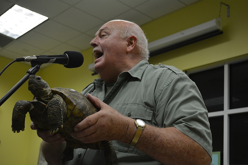 John Storms tells children a gopher tortoise can dig a tunnel up to 30 feet long.