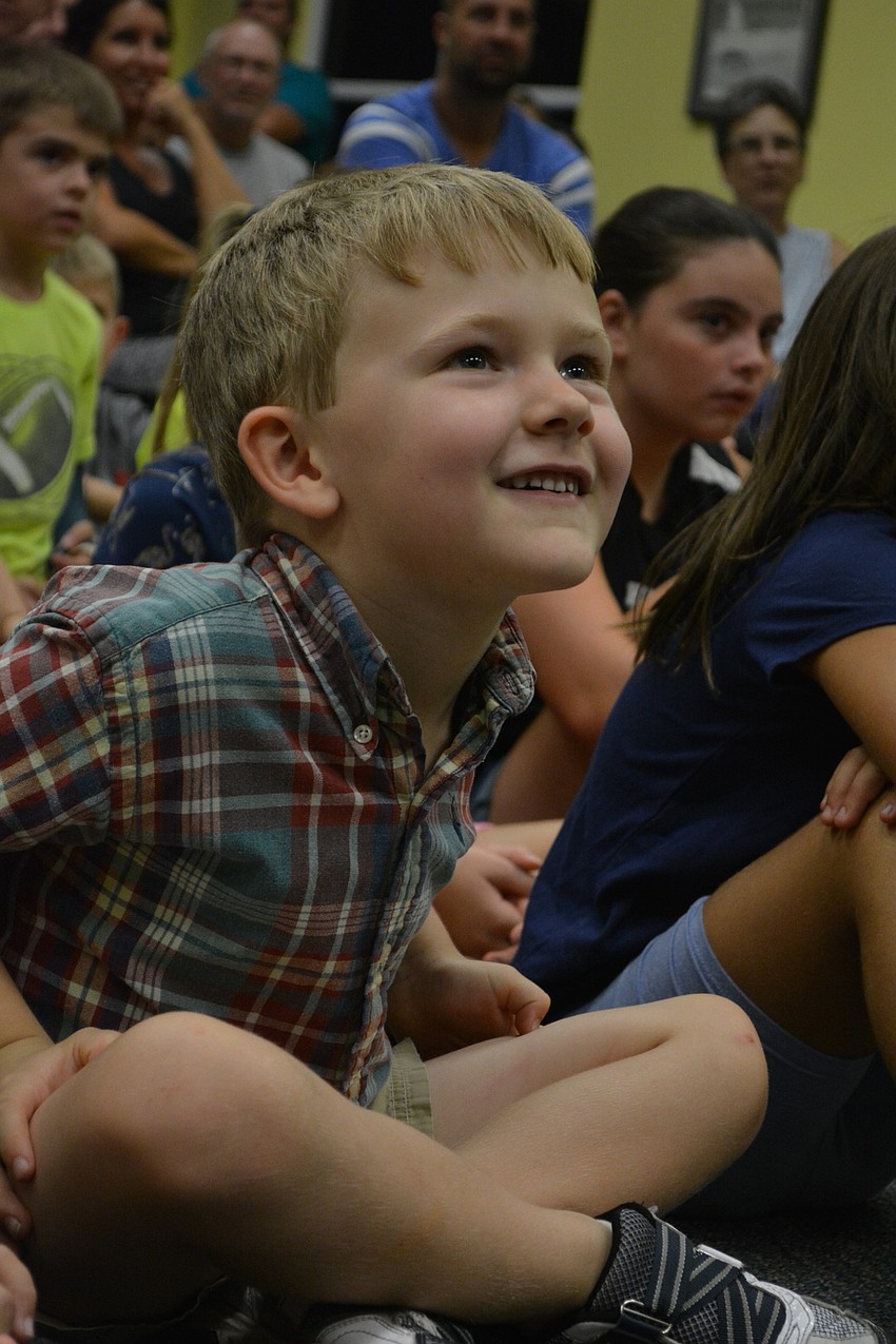 East County resident Ethan Parker, 5, is all smiles as a new reptile comes out.