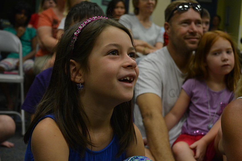 Creekwood's Aria Cooper, 8, enjoys learning about the various reptiles.