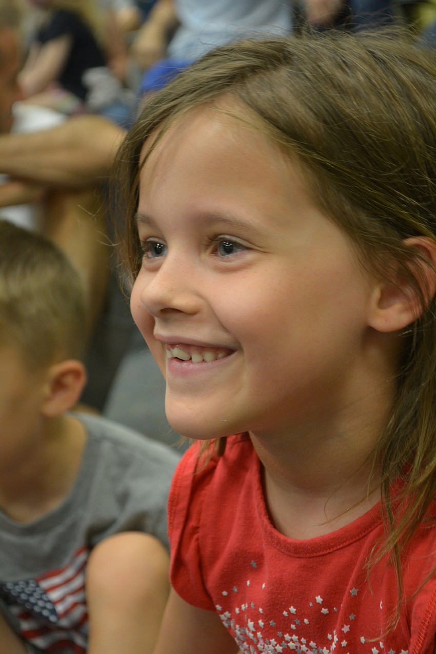Lakewood Ranch 6-year-old Cora Erhardt smiles after guessing that a unicorn is the Savannah monitor's lone predator. Her mom, Robyn, says, 