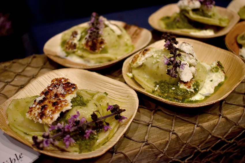 Seafood Shack served lionfish ravioli with basil pesto, whipped cream, toasted goat cheese and a basil blossom garnish.