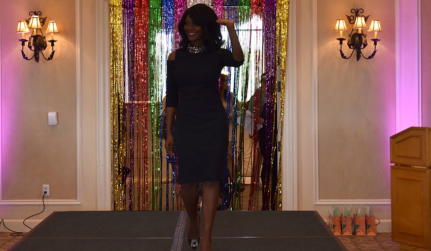 Miss America 2004 Ericka Dunlap waves to guests from the runway.