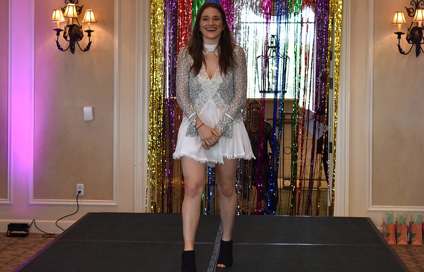 Danielle White laughs as she is introduced.