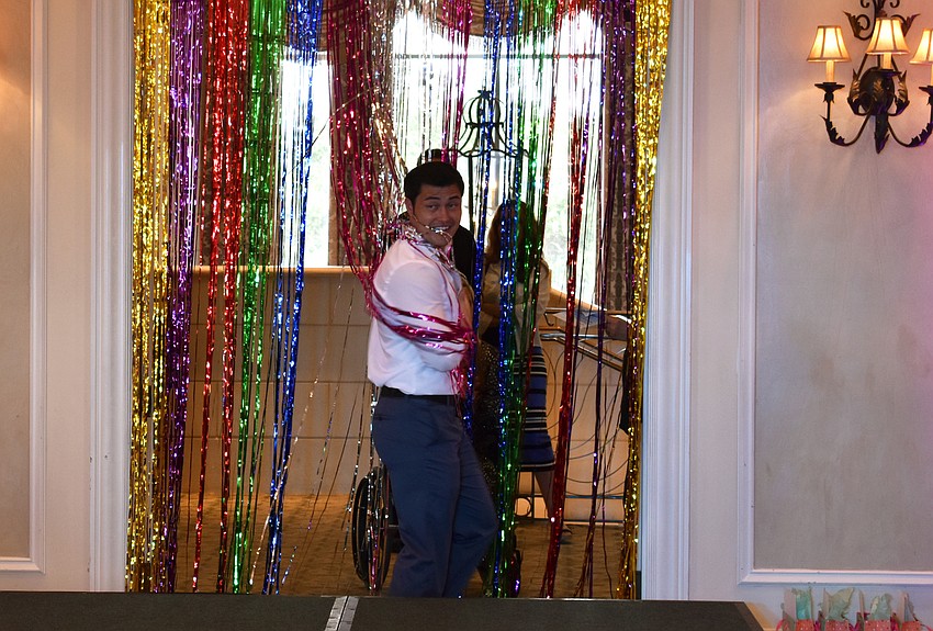 Christopher Sean pretends to get stuck in the doorway before he steps onto the runway.