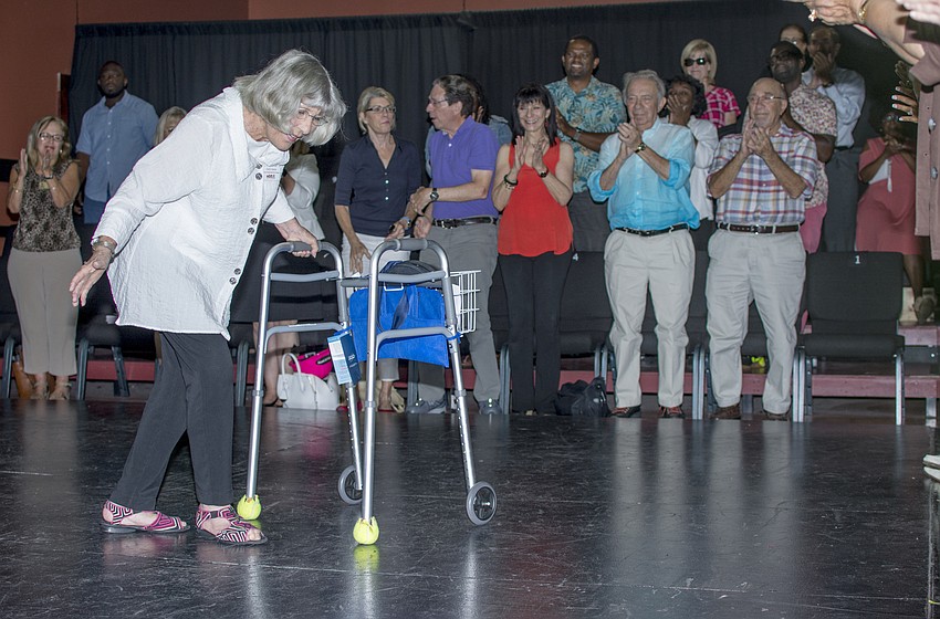 Lead donor for the capital improvement project Gerri Aaron takes a bow during the ground breaking program at Westcoast Black Theatre Troupe. It was announced that the theater building would be named for Aaron.