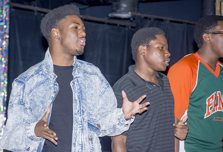 Derric Gobourne, Jamal Everett and  Todd Bellamy perform with other Westcoast Black Theatre Troupe summer campers.
