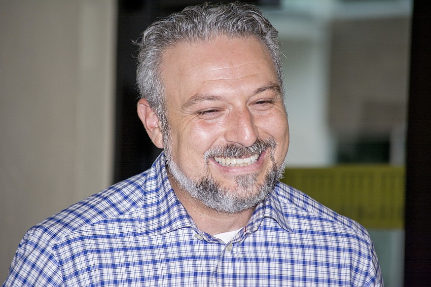 Rabbi Michael Shefrin laughs during the opening remarks of the event.