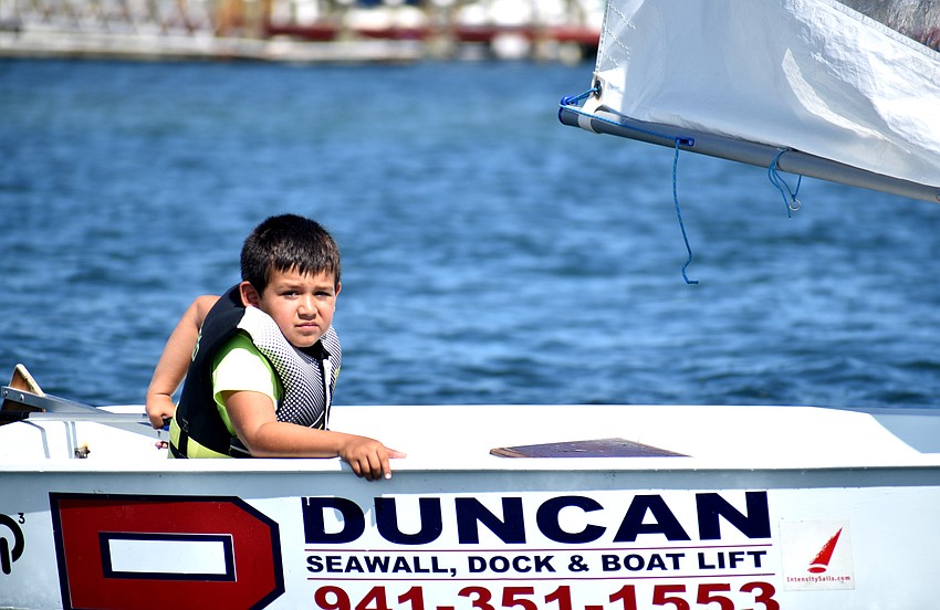 Giovanni Zampol makes his way toward the sandbar for a treasure hunt clue.