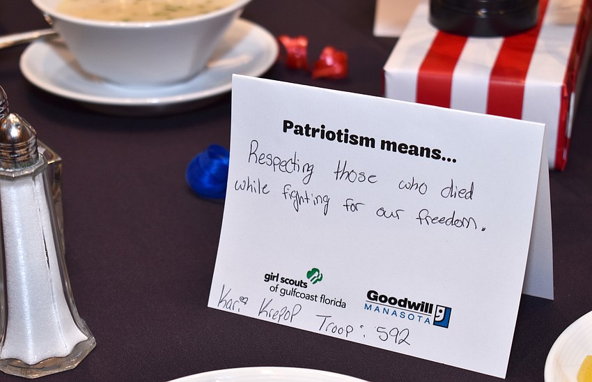 All the Girl Scouts filled out cards to explain what patriotism means to them, which were in turn used as part of the centerpieces at every table.