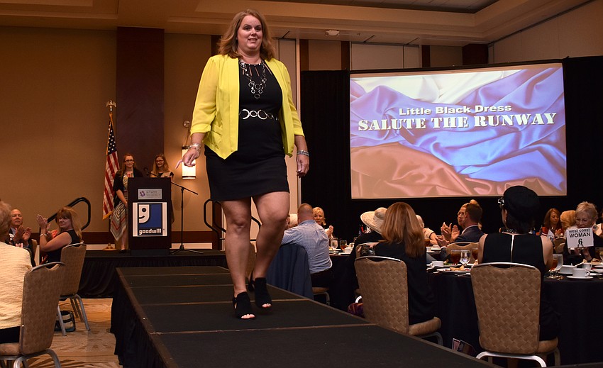 Renee Medina, U.S. Coast Guard veteran, shows off her Goodwill Manasota ensemble on the runway.
