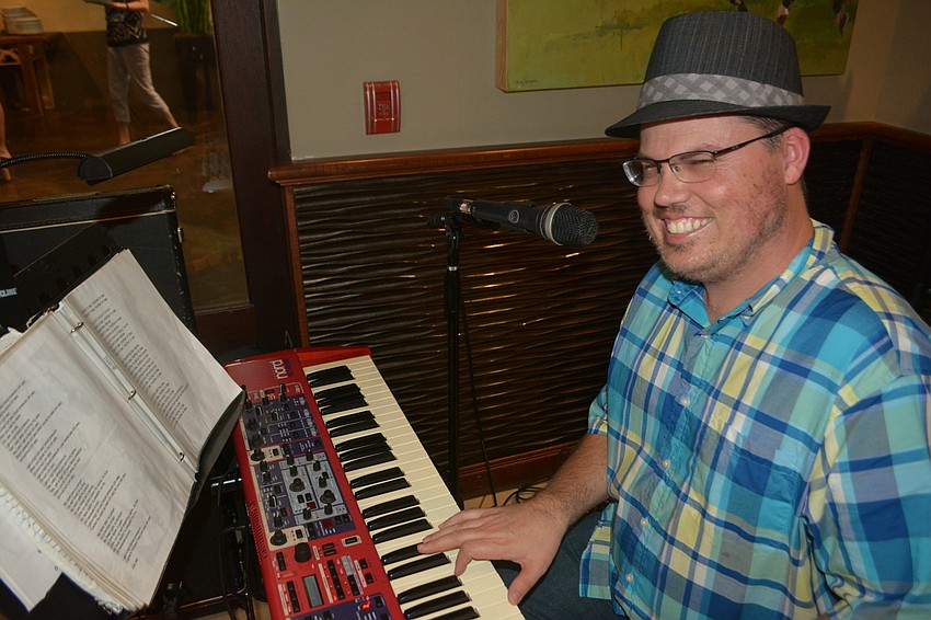 Ryan Langley of the Gumbo Boogie Band tickles the ivory.