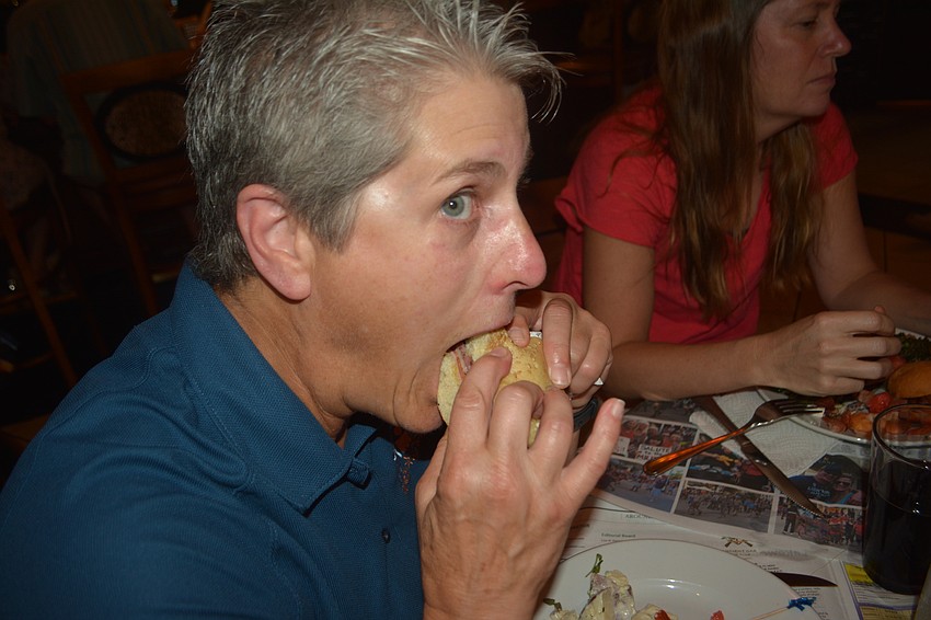 East County's Sharon Trepiccione takes on a muffaletta at the Spyder Broussard Low Country Boil.