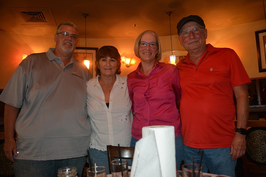 Clearwater's Paul Rebokus and Lisa Estes and East County's Jennifer Rebokus-Scott and Doug Scott take in their first Spyder Broussard Low Country Boil.