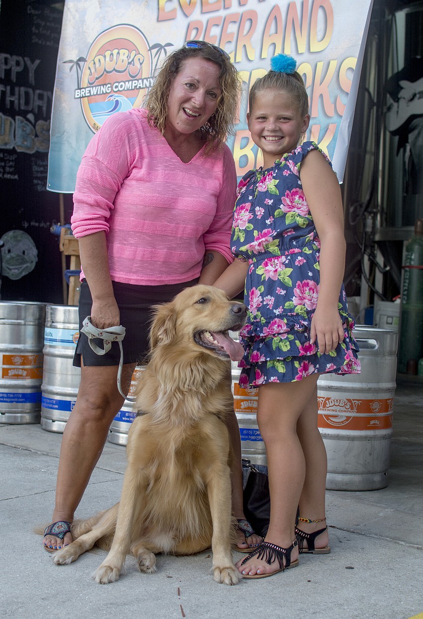 Kathy Martin and Maisey Tulla pose with dog Boca.