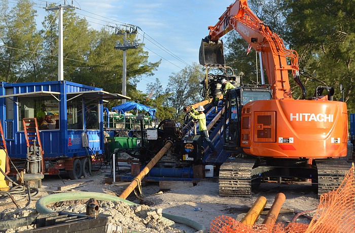 Work crews on the Bradenton Beach side of Longboat Pass are working on tunneling under the waterway for a power-transmission cable and a conduit to carry the island&#39;s new fiber-optic line.