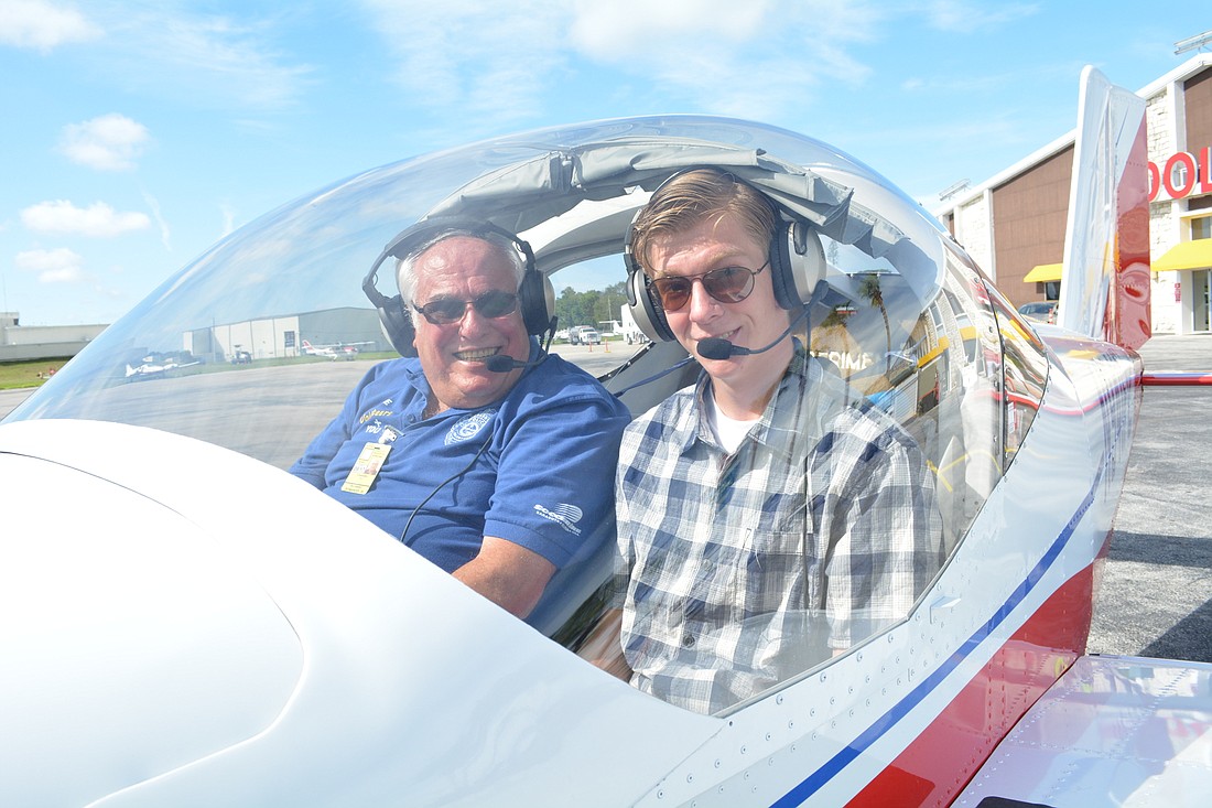 University Place&#39;s Ric Romanoff and 16-year-old Malcolum Moniz gear up for their flight to Oshkosh, Wisc. in a two-seat plane made by youths in the Teen Aircraft Factory of Sarasota program.