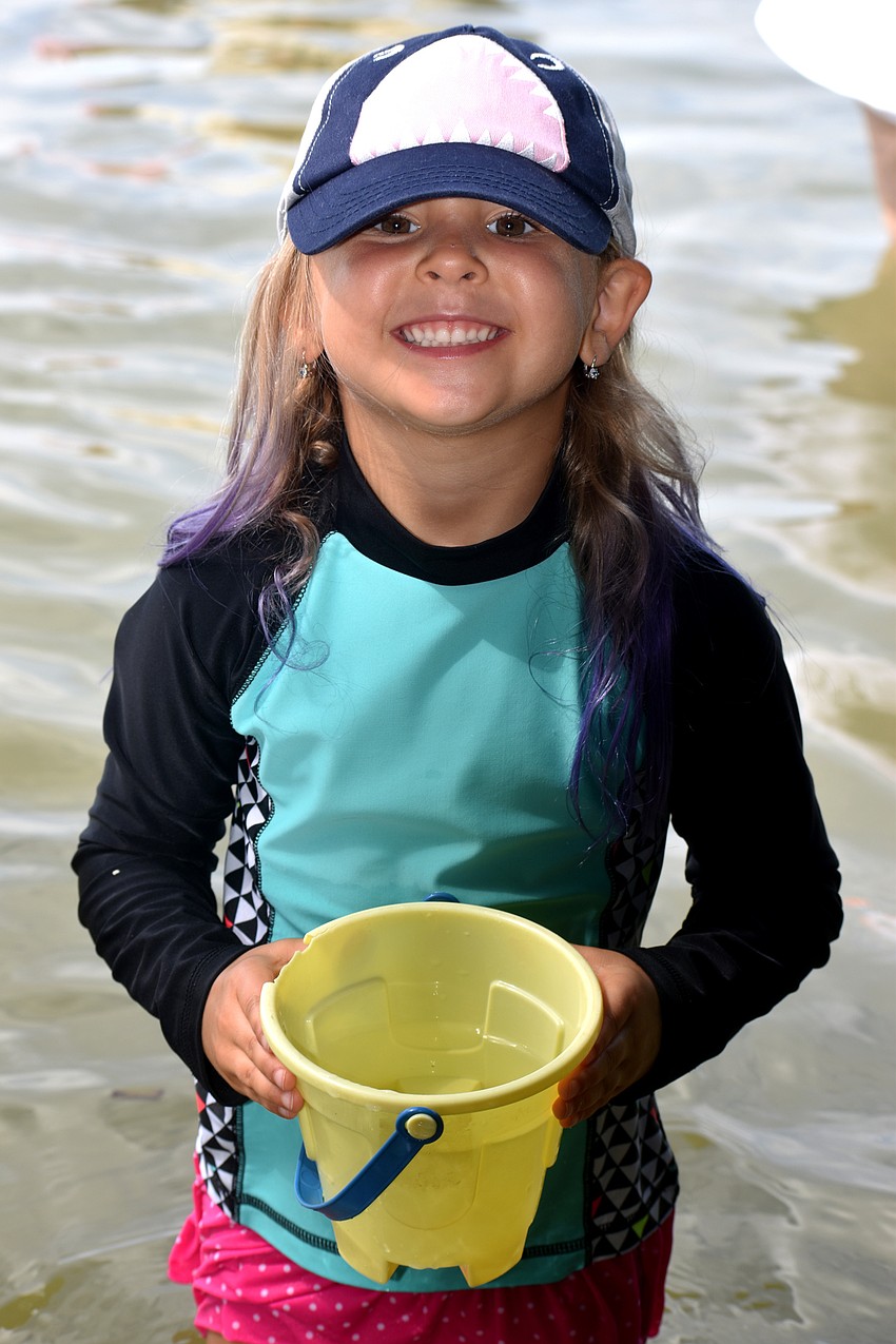 Brielle Sutton shows off her bucket while exploring Sarasota Bay.