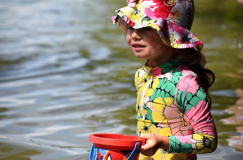 Ellie Otte watches her mom and other campers skim the Bay.