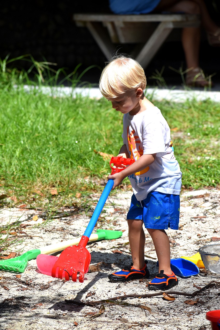 Luke Plummer takes a break from searching the Bay to play in the sand.