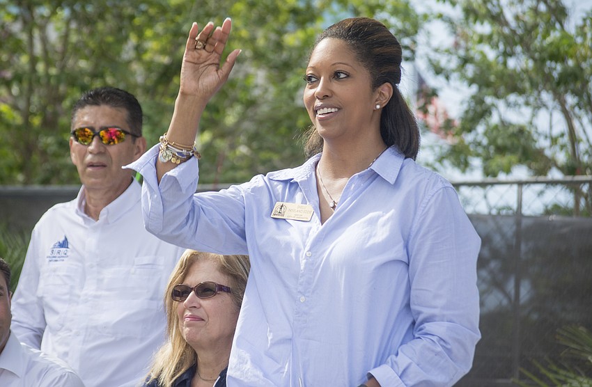 Mayor Shelli Freeland Eddie stands to be recognized at the park's rededication.