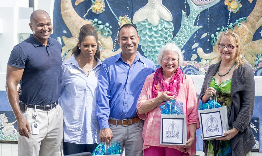 Parks and Recreation Director Jerry Fogle, Mayor Shelli Freeland Eddie, construction contractor Raymond Zuniga, ceramic artist Nancy Goodheart Matthews and Danielle Glaysher.