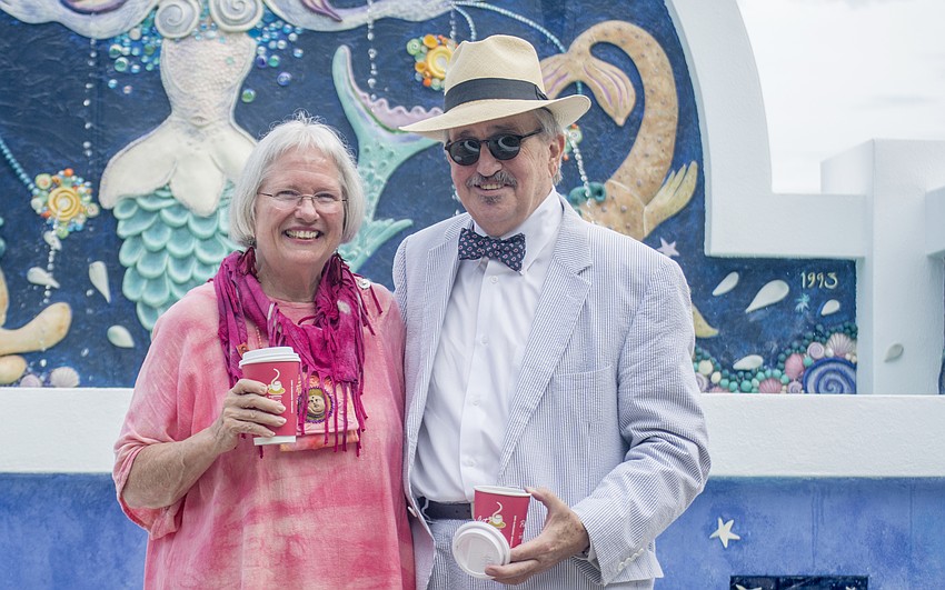 Ceramic artist Nancy Goodheart Matthews poses with Paul Gillen pose in front of the newly restored mermaid fountain in the newly renamed Paul Thorpe Park.