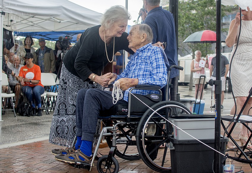 JoAnn and Paul Thorpe share a moment after Paul Thorpe revealed the naming plague for Paul N Thorpe Jr. Park.