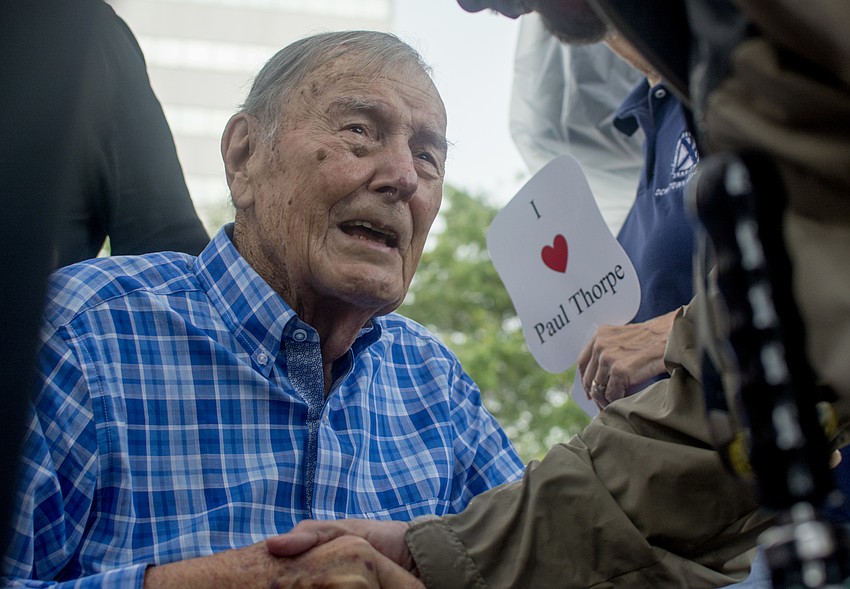 Paul Thorpe shakes hands with friends after the renaming ceremony.