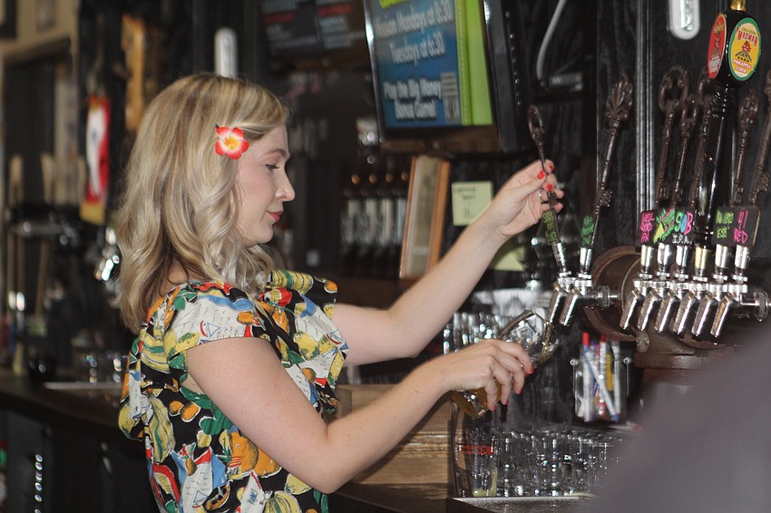 Lakewood Ranch's Amanda Tullidge pours a cold beer  3 Keys Brewing and Eatery during her shift as a guest bartender.