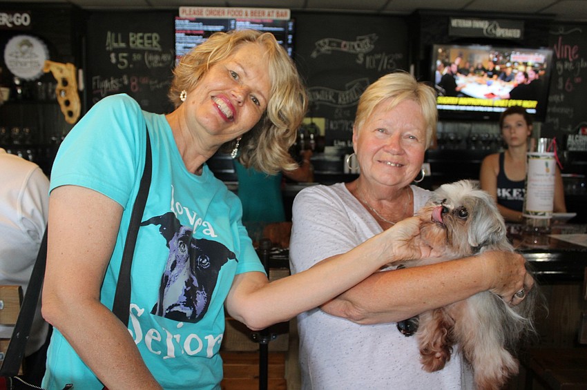 Vintage Paws volunteers Amy Fischer and Edie Anderson are in the house.