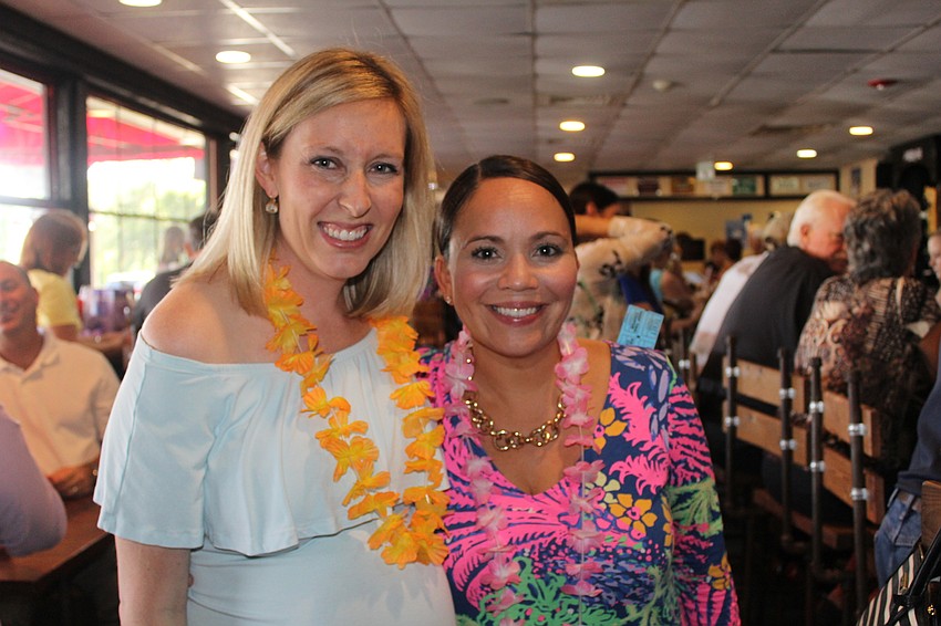 Cheers for Charity members Annie Breitinger and Marisa Powers dress for the occasion.