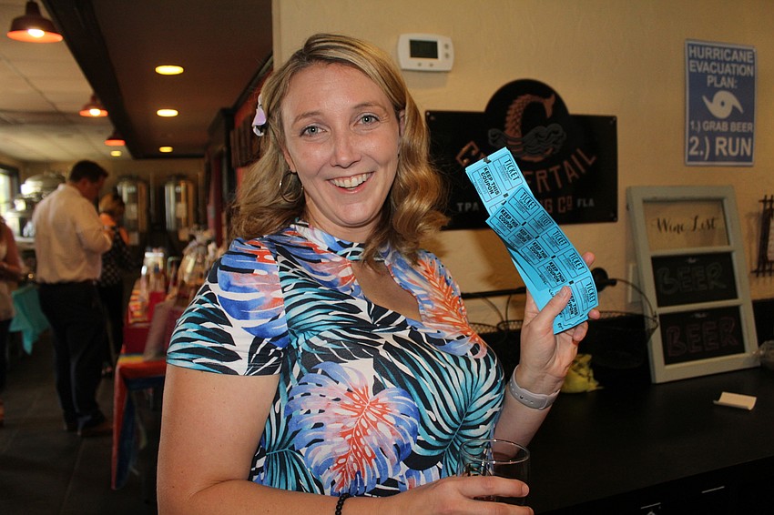 Cheers for Charity member Sierra Butler hopes she has the lucky raffle ticket.