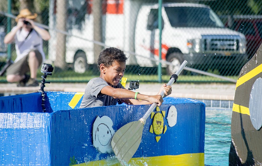 Jonathan paddles the Team Tropical boat during the the inaugural Rock the Boat Regatta that the Boys and Girls Club.