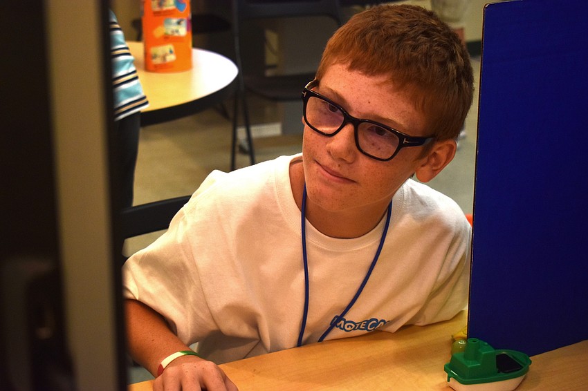 Caleb Jameson watches the Stopmotion video he made with Luke Scheinoh.