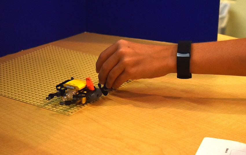 Luke Scheinoh moves a shark Lego piece for a Stopmotion video.