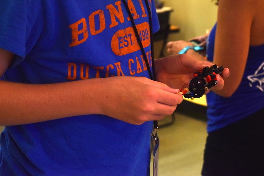 Henry Macke puts pieces together for the Lego Mindstorm.