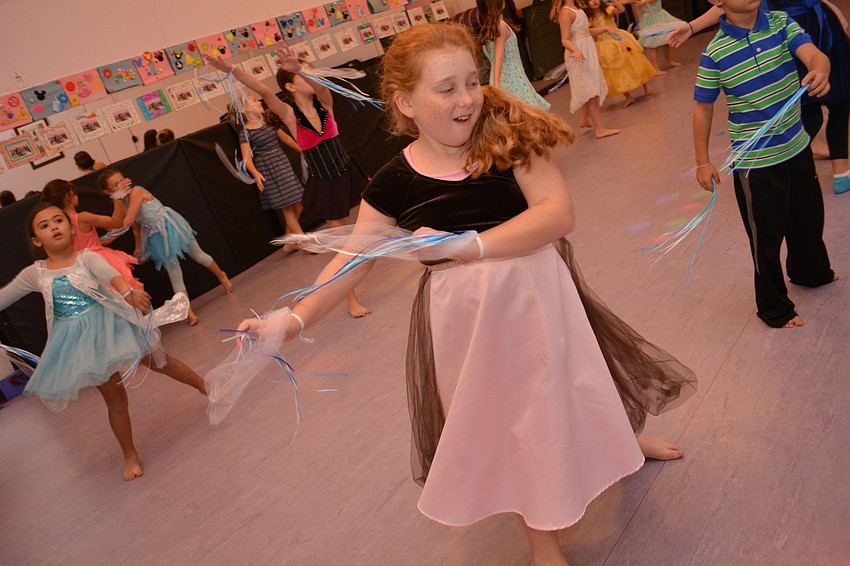 Olivia Michaels blows like the snow during a song from the movie, 