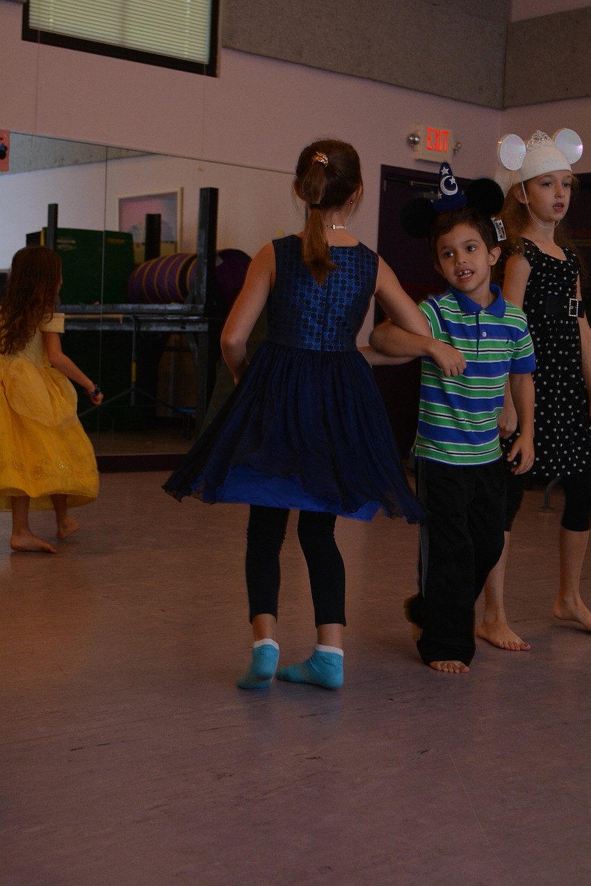 Thomas Gallen swings around his partner, Juliette Gallen.